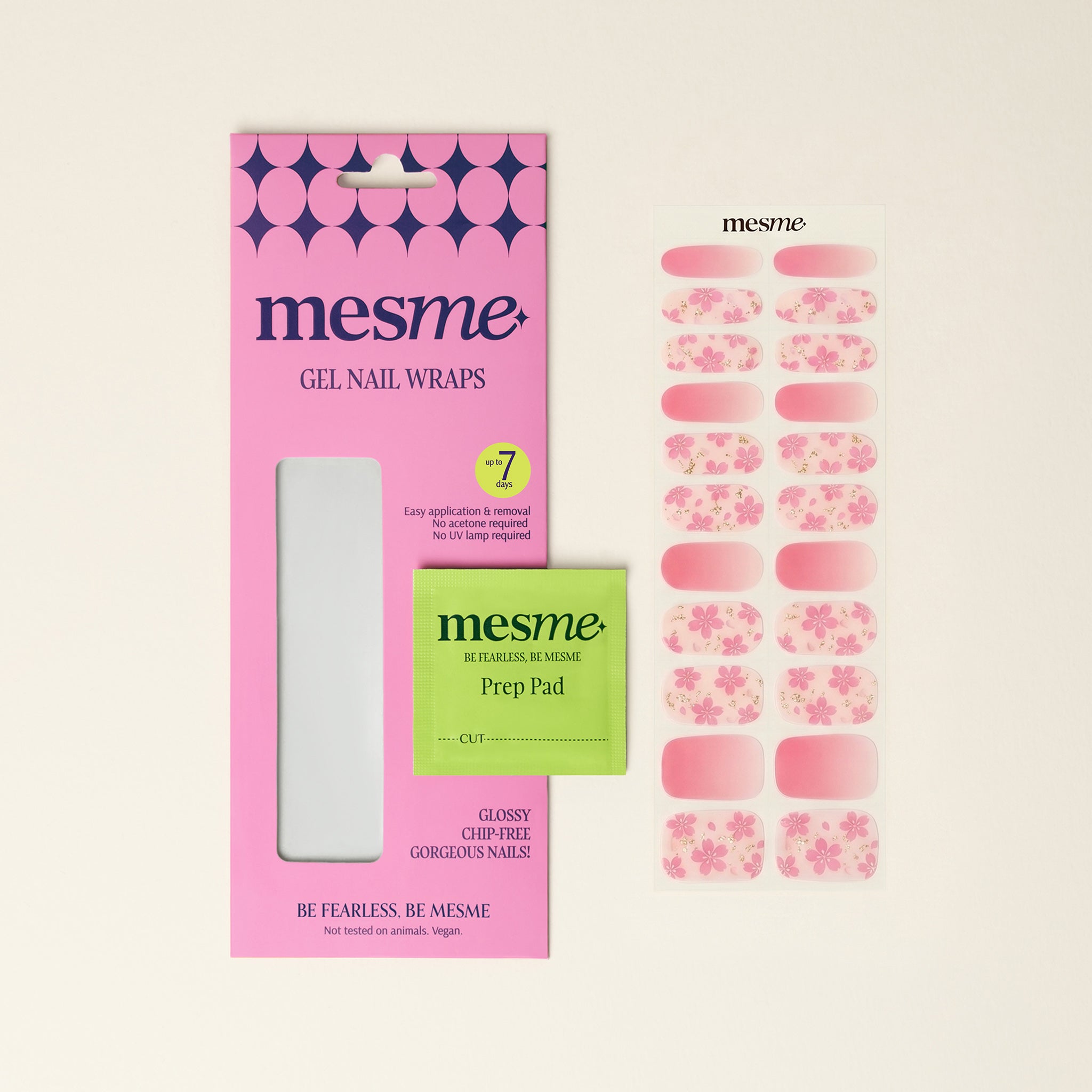 Marianne mesme gel nail wraps with peach-pink ombré, pink floral details, packaging and prep pad on a neutral background.