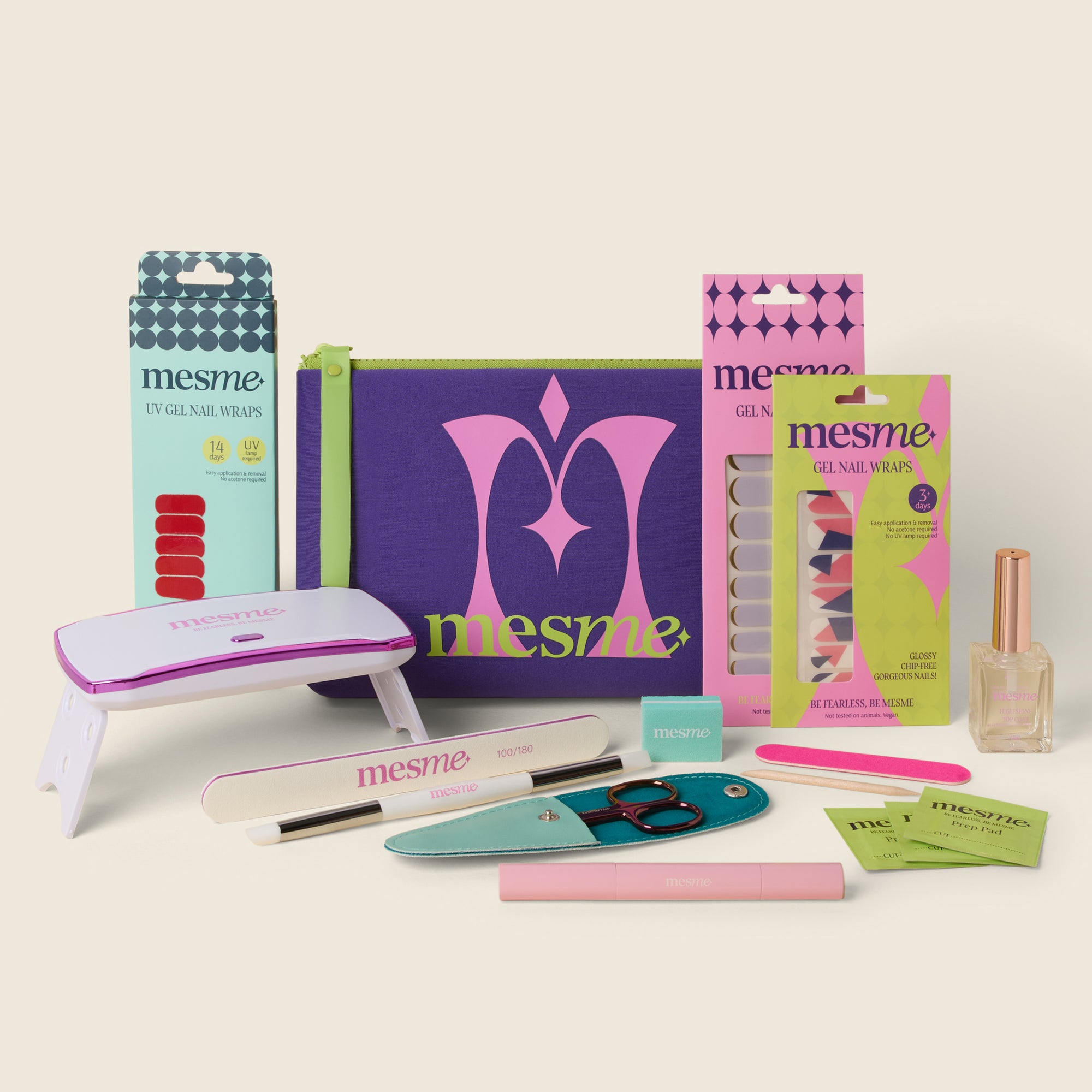 mesme Discovery gel wrap kit 3 different wrap types, a purple mesme cosmetic bag, a mini uv lamp, scissors, nail file, clear top coat, wrap remover pen and mini prep kit