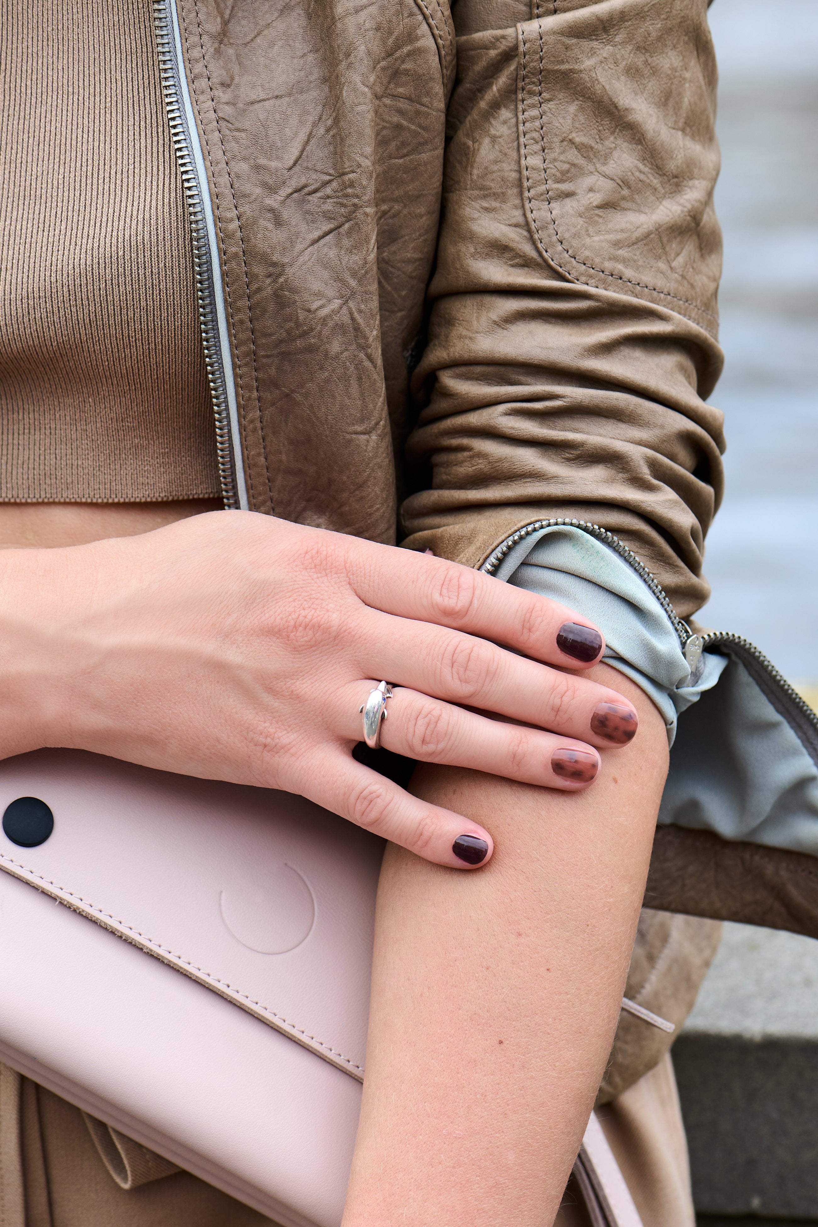 Lady in brown Autumn colours wearing mesme brown and animal print wrap nails