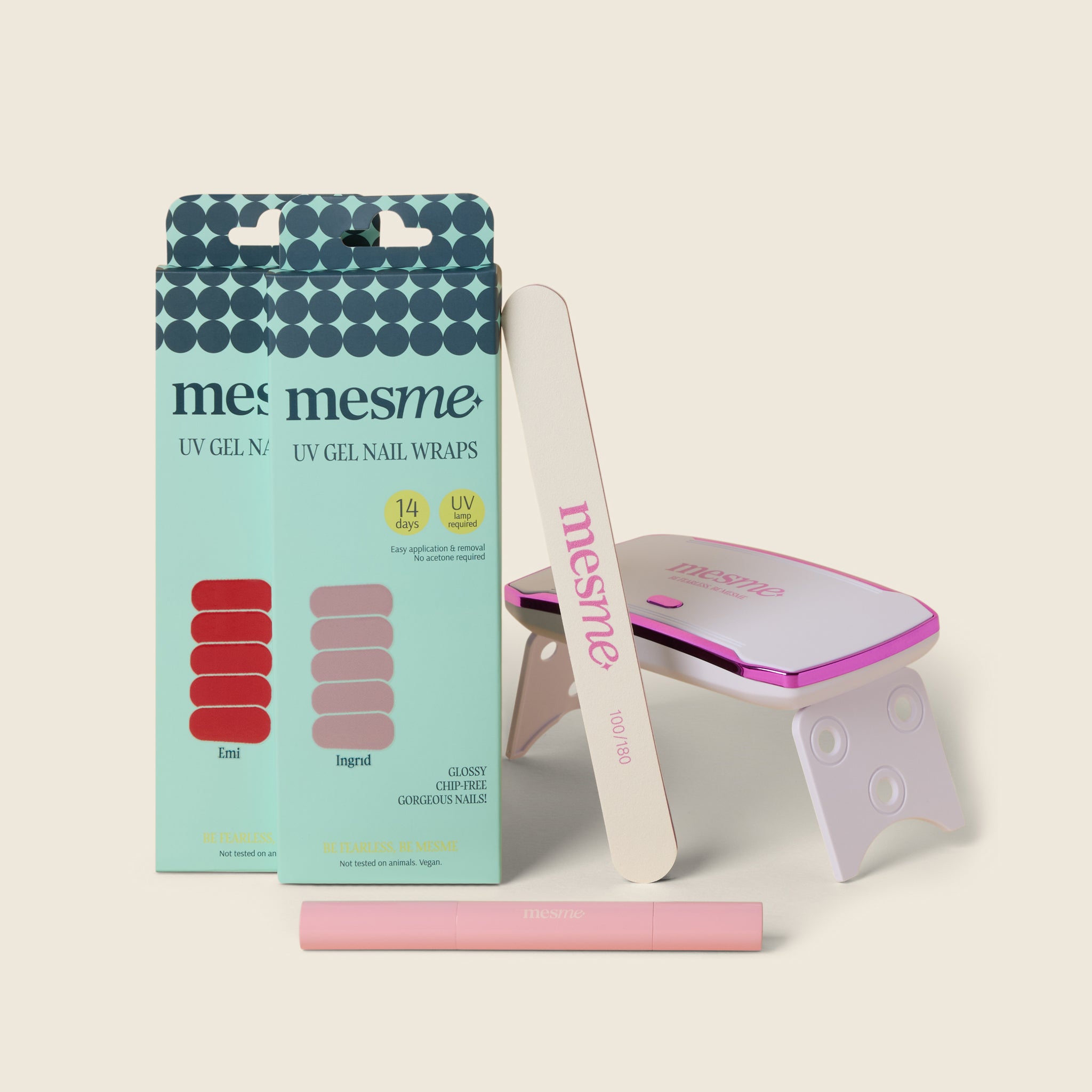 mesme 14 Day UV gel nail wraps packaging with a nail file, wrap remover pen and mini UV lamp on a beige background