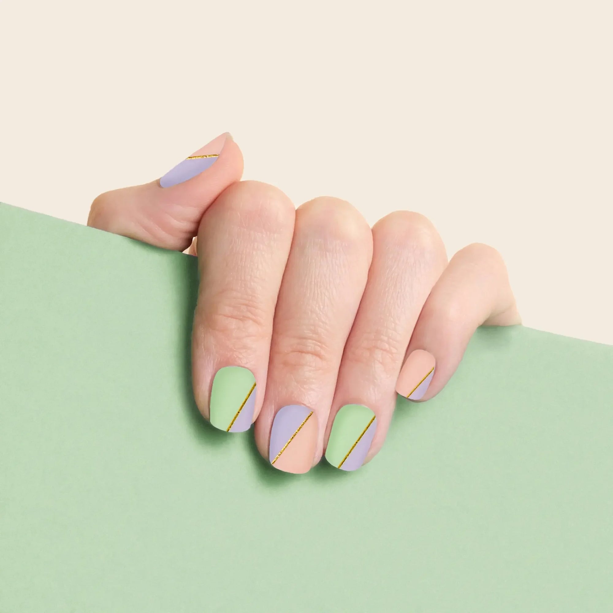 mesme Katya Pastel Gold 3+ Day UV-Free Gel Nail Wraps On Hand