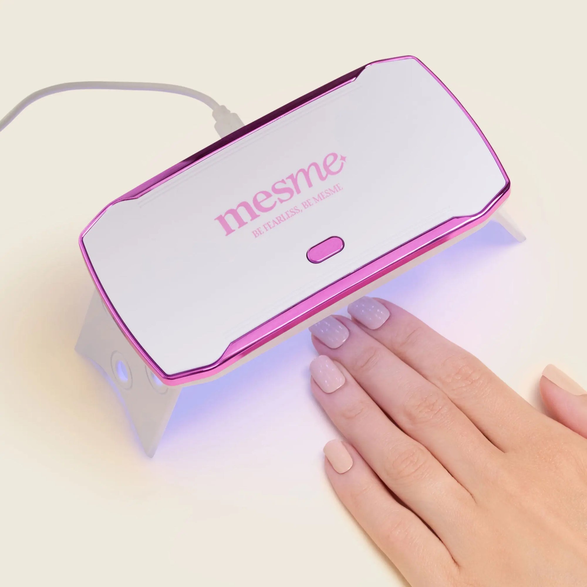 mesme Mini UV/LED Lamp (36W) — for 14-day UV gel wraps — hand holding/positioning the lamp (in use)