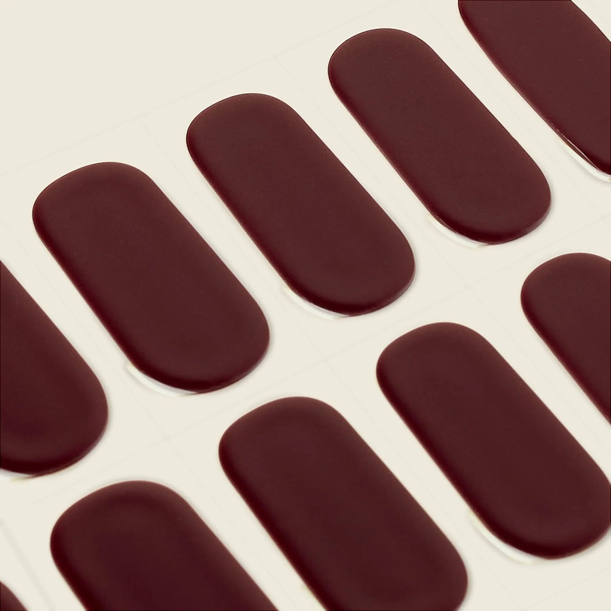 mesme Pili Burgundy Red 14-Day UV Gel Nail Wraps — Strip Sheet Close-Up